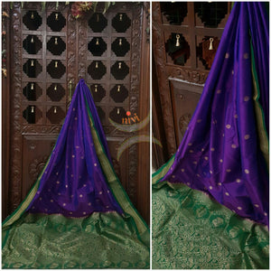 Purple silk Paithani with traditional peocock motif comes with contrasting Green border and pallu.