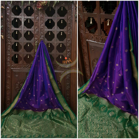 Purple silk Paithani with traditional peocock motif comes with contrasting Green border and pallu.