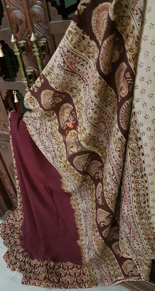 Maroon Patli pallu chennur silk kalamkari with floral motif and intricate peacock motif on pallu.