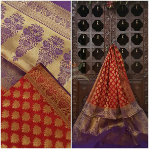 Orange Silk Cotton Benaras with traditional Brocade weaving all over the saree with contrasting purple pallu.