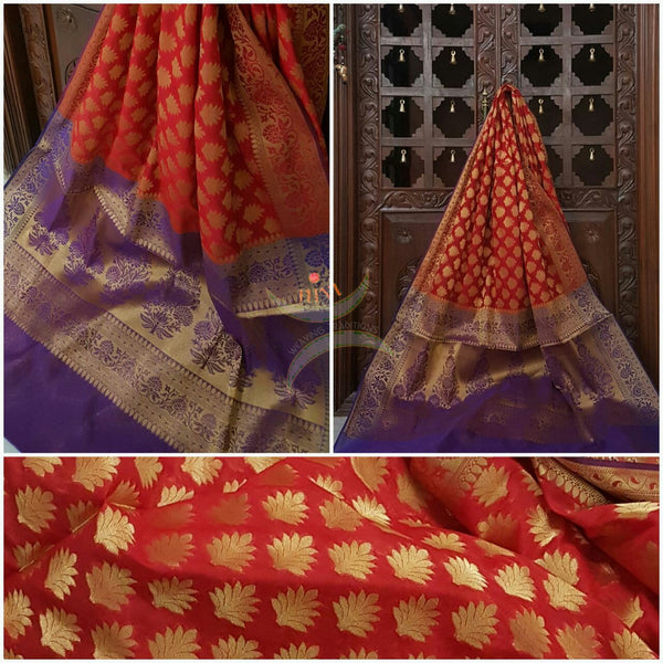 Orange Silk Cotton Benaras with traditional Brocade weaving all over the saree with contrasting purple pallu.