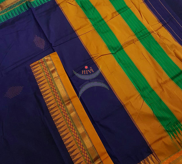 Royal blue Gadwal Silk Cotton saree with Ganga Jamuna temple border and woven booties all over and traditional tope teni pallu.