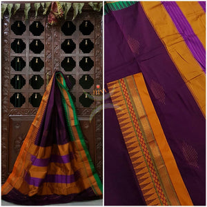 Purple Gadwal Silk Cotton saree with Ganga Jamuna temple border and woven booties all over and traditional tope teni pallu.