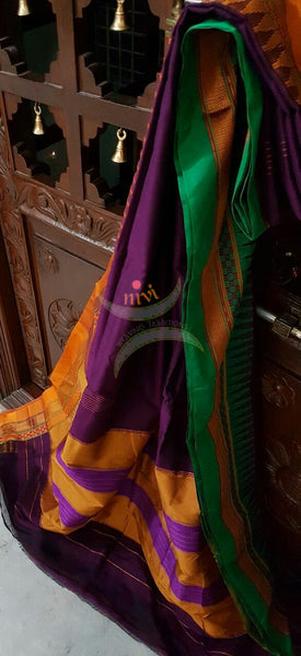 Purple Gadwal Silk Cotton saree with Ganga Jamuna temple border and woven booties all over and traditional tope teni pallu.