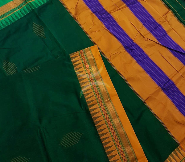 Green Gadwal Silk Cotton saree with Ganga Jamuna temple border and woven booties all over and traditional tope teni pallu.
