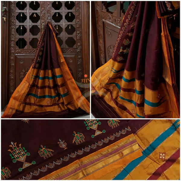 Maroon with mustard silk cotton kasuti embroidered Ilkal with Anne ambari motif and traditional tope teni pallu . 