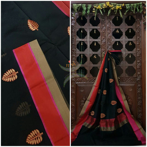 Black silk cotton brocade saree with satin finish contrasting border and pallu with embroidery allover the saree.