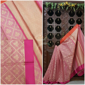 Soft Pink silk cotton benaras brocade saree with satin finish contrasting pink orange border and antique woven gold zari all over the saree.