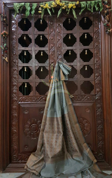 Grey silk cotton benaras brocade saree with antique gold zari woven border and pallu.