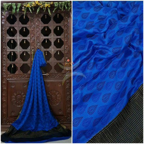 Royal blue 40 gram Chinon Printed crepe pure silk with contrasting Black zari border.