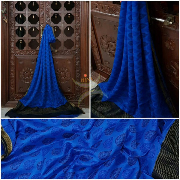 Royal blue 40 gram Chinon Printed crepe pure silk with contrasting Black zari border.