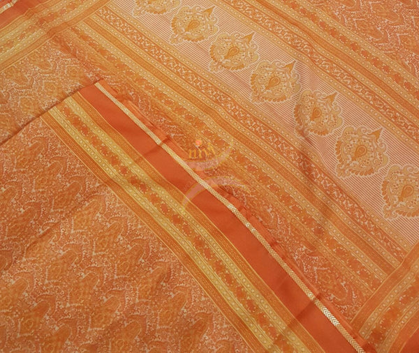 Orange wrinkle printed crepe with floral print.