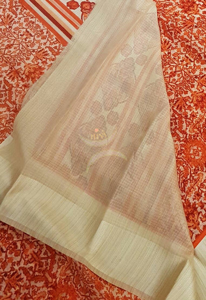 Orange with cream printed Kota Cotton saree with tissue finish cream border.