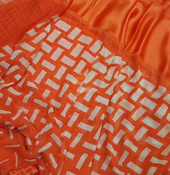 Orange wrinkle printed crepe with satin finish and Abstract Geometrical print.
