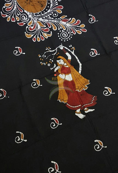 Black with Mustard Red Handloom Mul Cotton Batik printed dress material with floral and a lady motif for top and diagonal lines for bottom and dupatta.