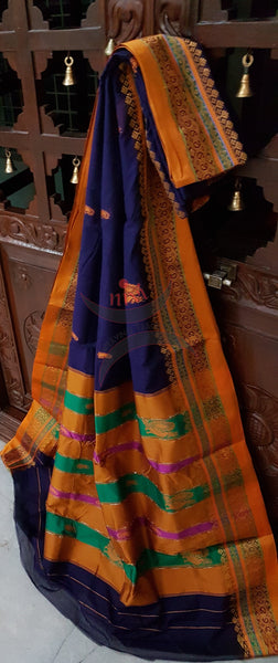 Royal blue with mustard sico traditional South saree with peacock and paisley motif allover the saree, border and pallu. Saree comes with running blouse.