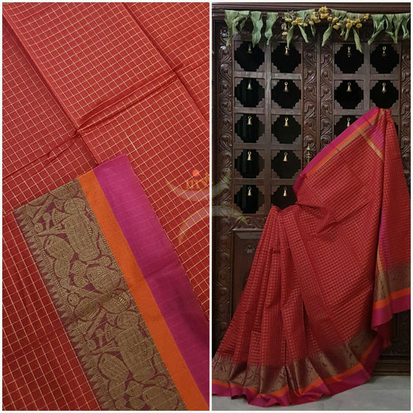 Red Silk Cotton chequered saree with satin finish contrasting pink orange border and woven musical instruments at border with antique gold zari. Saree comes with running blouse.