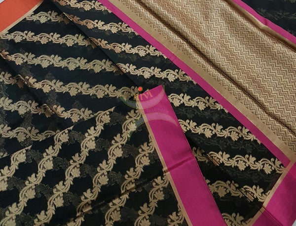 Black silk cotton Benaras Brocade Supernet saree with satin finish contrasting pink orange border and antique woven antique gold zari all over the saree.