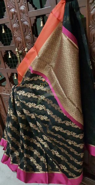 Black silk cotton Benaras Brocade Supernet saree with satin finish contrasting pink orange border and antique woven antique gold zari all over the saree.