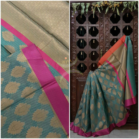 Teal Silk Cotton Benaras Brocade Supernet saree with satin finish contrasting pink orange border and antique woven gold zari all over the saree.