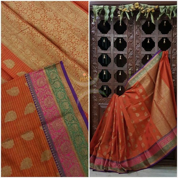 Orange Silk Cotton Benaras Brocade saree with antique zari weaving all over the saree.