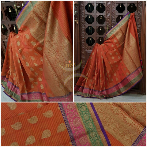 Orange Silk Cotton Benaras Brocade saree with antique zari weaving all over the saree.