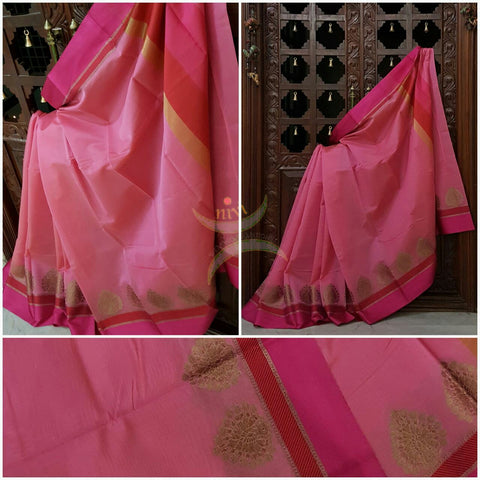 Soft Pink Mercerized cotton saree with satin finish contrasting pink and orange pallu and border. Border comes with antique zari motifs.