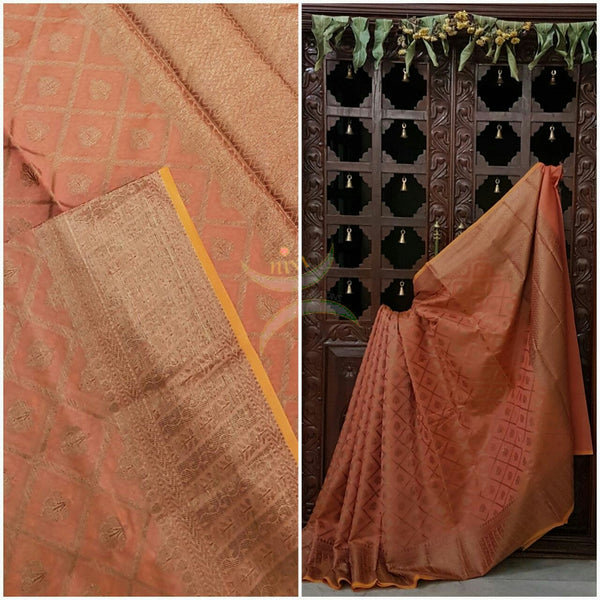 Peach Silk Cotton Benaras Brocade saree with woven Brocade border and antique woven gold zari all over the saree.