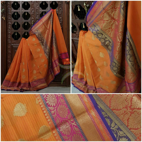 Orange Silk Cotton Benaras Brocade saree with antique zari weaving all over the saree.