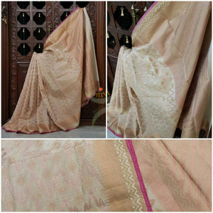 Cream shot Gold Silk Cotton Benaras Brocade Supernet saree with woven Brocade tissue border and antique woven gold zari all over the saree.