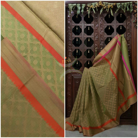 Mehendi Green Silk Cotton Benaras Brocade saree with contrasting pink orange satin finish lines at border and pallu .Saree is woven with antique gold zari at border ,pallu and all over the saree.