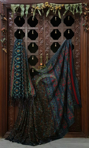 Black Semi Pashmina Printed Saree with paisley and floral print.Saree comes with Stole and contrasting printed blouse.