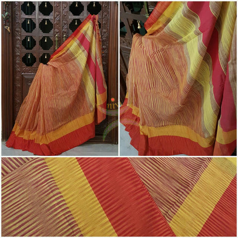 Orange Handloom soft Cotton Ikat with contrasting red yellow pallu and  border.
