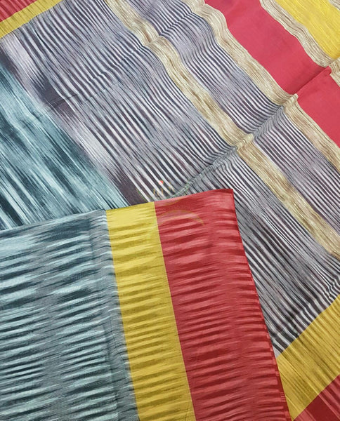 Grey Handloom soft Cotton Ikat with contrasting red yellow pallu and  border.