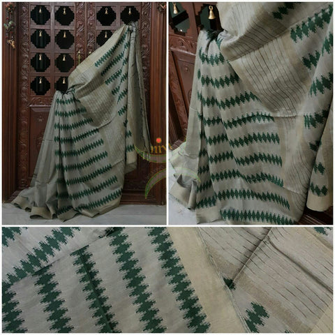 Grey Bengal Handloom cotton with self woven vertical lines all over the saree with Geecha pallu. Saree comes with woven striped blouse . 