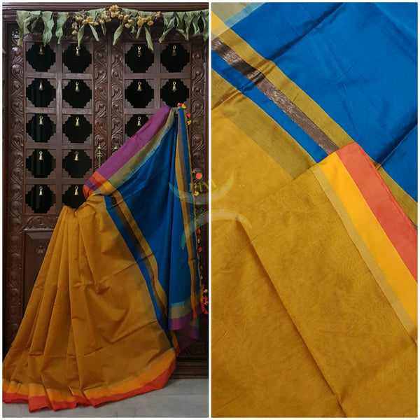 Mustard Handloom merserised soft cotton saree with contrast yellow orange border. saree comes with blue pallu and blue blouse.