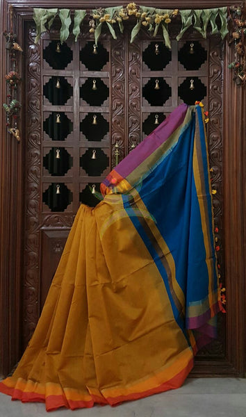 Mustard Handloom merserised soft cotton saree with contrast yellow orange border. saree comes with blue pallu and blue blouse.
