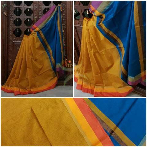Mustard Handloom merserised soft cotton saree with contrast yellow orange border. saree comes with blue pallu and blue blouse.