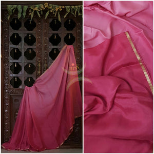 Pink 40 gms Two Tone pure Silk Crepe with a fine zari border. Saree comes with pure pink crepe blouse in darker tone.