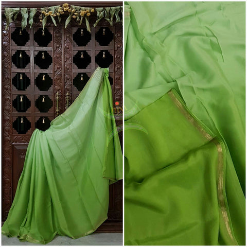 Pista Green 40 gms Two Tone pure Silk Crepe with a fine zari border. Saree comes with pure pista green crepe blouse in darker tone.