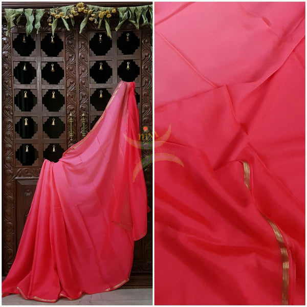 Pink 40 gms Two Tone pure Silk Crepe with a fine zari border. Saree comes with pure pink crepe blouse in darker tone.