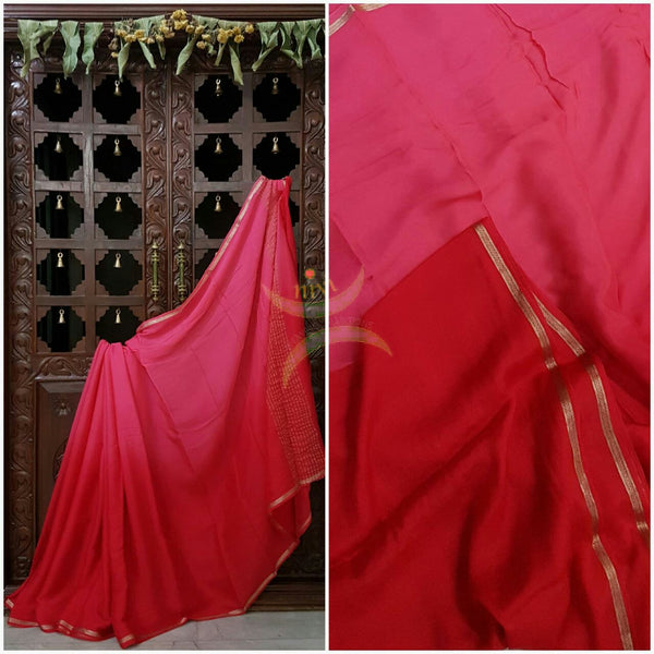 40 gms Two Tone pure Silk Crepe in shades of pink and red with a fine zari border. Saree comes with pure red crepe blouse .