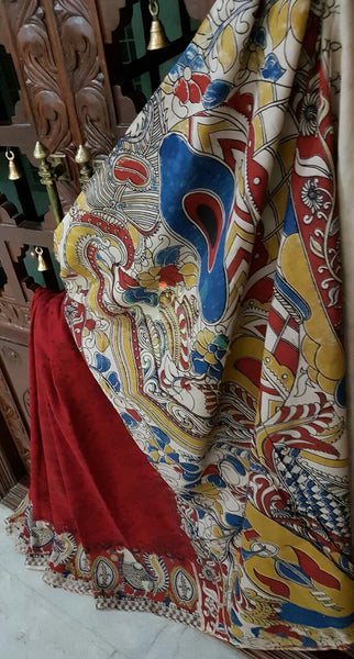 Maroon and off white chennur silk kalamkari with intricate peacock motif on pallu  border and musical instruments all over the saree.