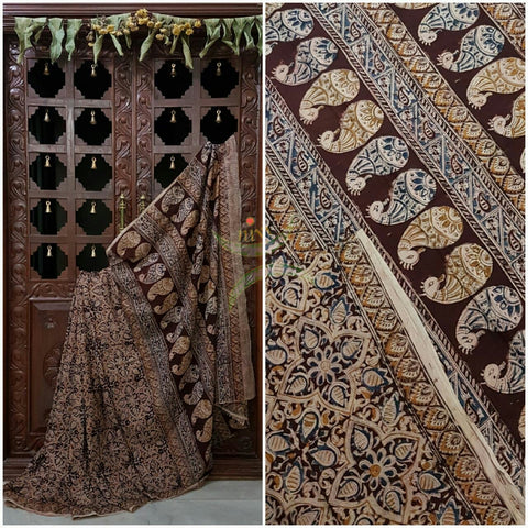 Brown mul cotton kalamkari with intricate floral motif on the body of the saree and Paisley motif on the pallu .