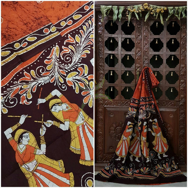 Rust orange brown handloom Mul Cotton Batik saree with human figure motif on contrasting Brown border and pallu