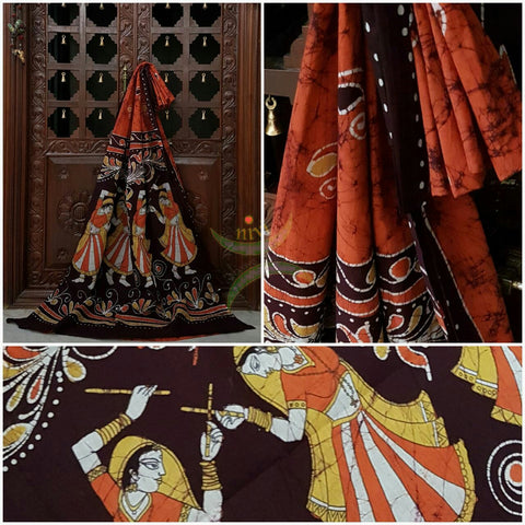 Rust orange brown handloom Mul Cotton Batik saree with human figure motif on contrasting Brown border and pallu
