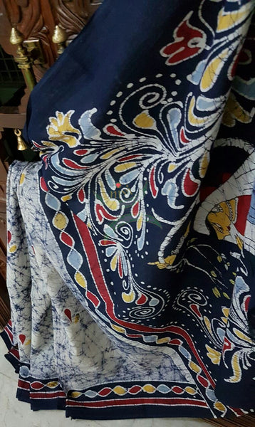 Grey off white handloom Mul Cotton Batik saree with human figure motif on contrasting Navy blue border and pallu