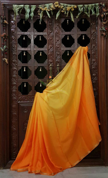 40 gms Two Tone pure Silk Crepe in shades of yellow orange with a fine zari border. Saree comes with pure orange crepe blouse .