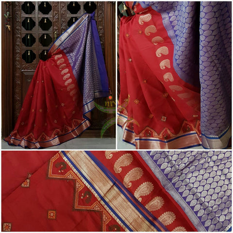 Red with blue kota cotton saree with kasuti embroidery. Saree is woven with Paisley motif and Brocade border and pallu.