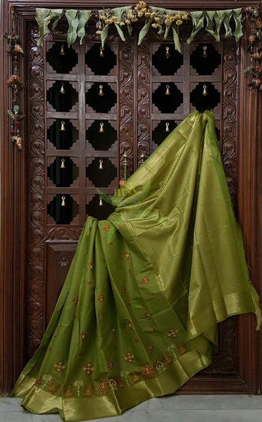 Green kota Cotton saree with kasuti embroidery. Saree is woven Brocade zari border and pallu.